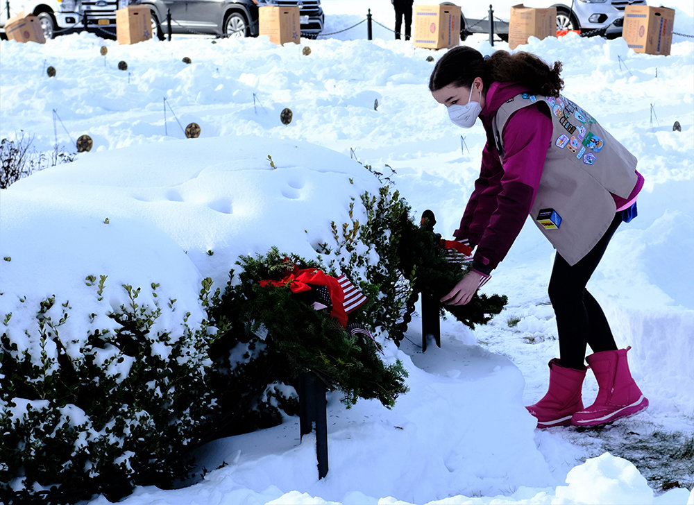 Girl Scout Erin O’Donnell laid one of the first wreaths on a soldiers grave.